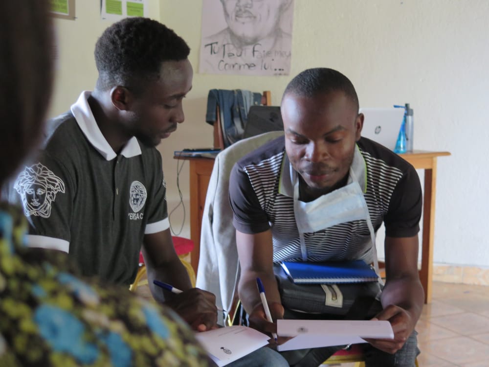 two people sitting close and discussing