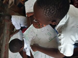 a young black boy filling out a tree of life